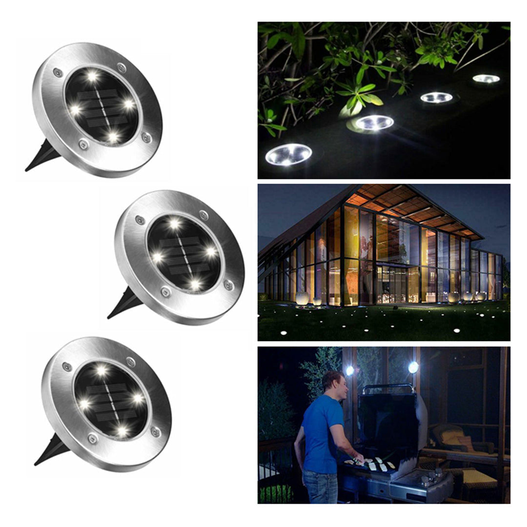 "Aurinkoenergialla toimivat LED-polkuvalot puutarhaan, hopeinen runko, lämpimän valkoiset LEDit, istutettuna nurmikolle."