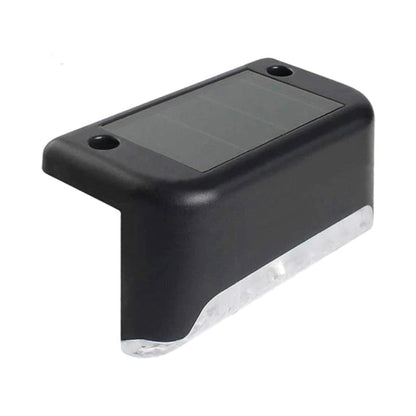 "Aurinkovoimainen musta terassivalo, lämmintä sävyä, vesitiivis, moderni muotoilu ulkokäyttöön."